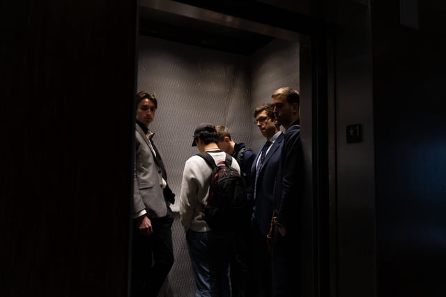 Staffers with the Department of Government Efficiency enter the offices of the U.S. African Development Foundation in Washington, DC, on Thursday.