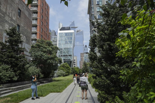 FILE - People walk along the High Line Park, Thursday, July 16, 2020, in New York. (AP Photo/Frank Franklin II, File)