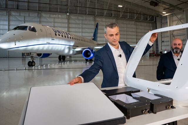 Doug Stoltz, director of cabin systems engineering at United Airlines, left, and Monal Merchant, director of TechOps Strategy at United Airlines, display a Starlink setup which will replace older broadband wi-fi on United Airlines flights, during a media preview at Nashville International Airport (BNA) in Nashville, Tennessee, US, on Wednesday, March 5, 2025. 