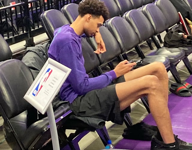 Victor Wembanyama sits on the bench on Friday, March 7, 2025 during shootaround in Sacramento as the Spurs get ready to play the Kings that night. Wembanyama is out for the season with a blood clot in his shoulder.