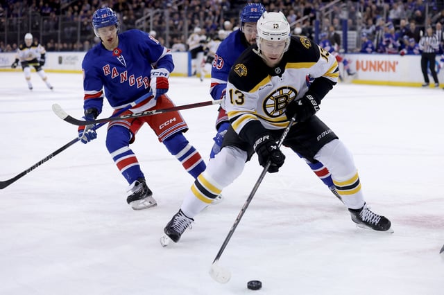  Feb 5, 2025; New York, New York, USA; Boston Bruins center Charlie Coyle (13) controls the puck against New York Rangers left wing Artemi Panarin (10) and center Mika Zibanejad (93) during the first period at Madison Square Garden. Mandatory Credit: Brad Penner-Imagn Images/File Photo