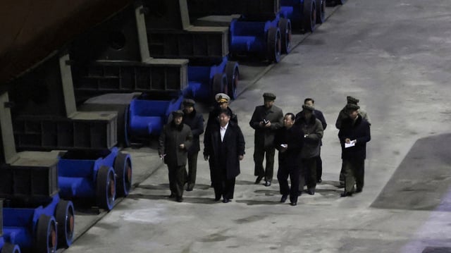 North Korea's leader Kim Jong Un inspects a nuclear submarine during a visit to a shipyard in this photo released by North Korea's official Korean Central News Agency on March 8, 2025.