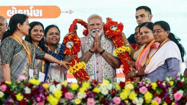 Prime Minister Narendra Modi addressing at Vansi Borsi village in Gujarat’s Navsari district on International Women’s Day (Narendra Modi Photo Gallery)