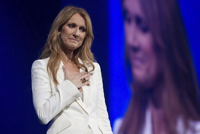 Celine Dion gestures as she performs at the Bell Centre in Montreal, Sunday, July 31, 2016. 