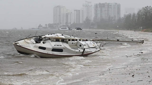 Ex-Tropical Cyclone Alfred has started to move across the coast as a tropical low.