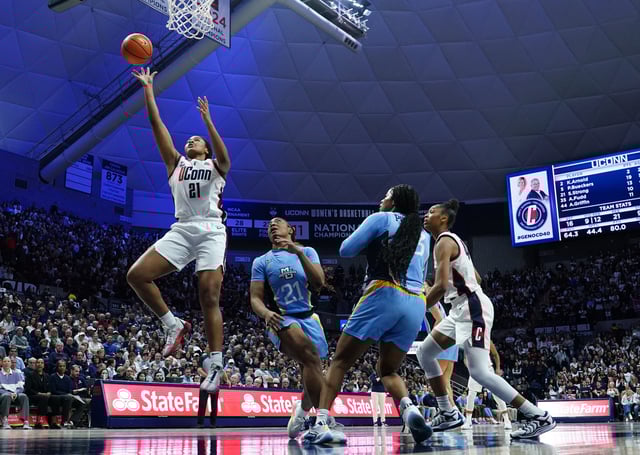 Mar 2, 2025; Storrs, Connecticut, USA; UConn Huskies forward Sarah Strong (21) shoots the ball against Marquette Golden Eagles guard Kennedi Perkins (21) in the second half at Harry A. Gampel Pavilion. David Butler II-Imagn Images/File Photo