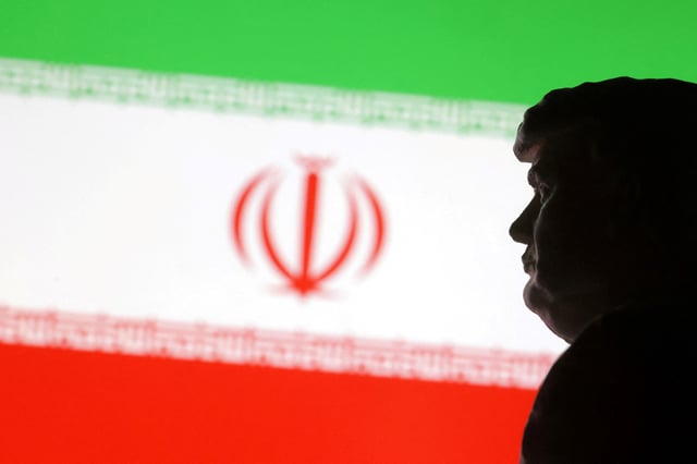 A 3D-printed miniature model of U.S. President-elect Donald Trump and the Iran flag are seen in this illustration taken January 15, 2025. REUTERS/Dado Ruvic/Illustration/File Photo