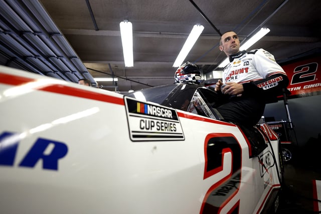 Austin Cindric, driver of the #2 Discount Tire Ford enters his car in the garage area during practice for the NASCAR Xfinity Series United Rentals 300 at Daytona International Speedway on February 14, 2025 in Daytona Beach, Florida.