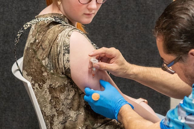 LUBBOCK, TEXAS - MARCH 01: Twelve year old Kyleigh Wilkes, receives an MMR vaccine from Raynard Covarrubio, at a vaccine clinic put on by Lubbock Public Health Department on March 1, 2025 in Lubbock, Texas. Cases of Measles are on the rise in West Texas as over 150 confirmed case have been seen with one confirmed death.(Photo by Jan Sonnenmair/Getty Images)
