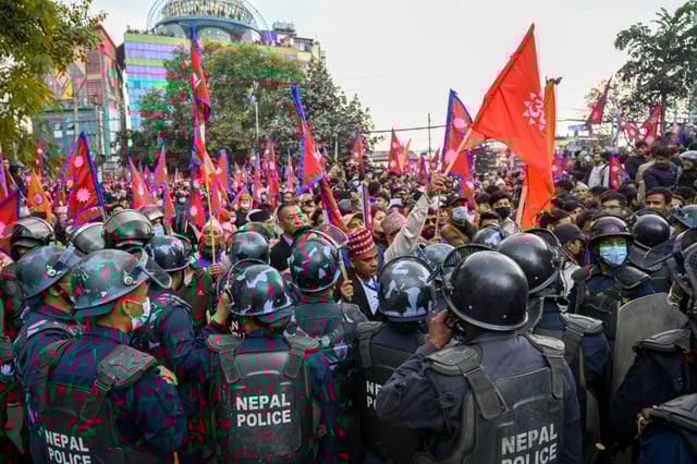 Nepal's former king  Gyanendra Shah was welcomed back to Kathmandu at the airport by supporters who have staged pro-monarchy demonstrations