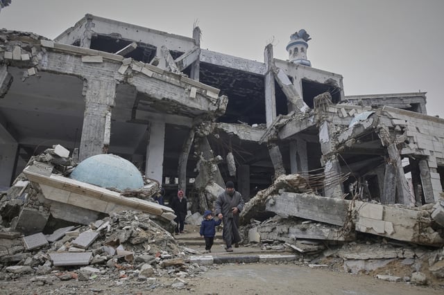 Palestinians leave after attending the first Friday prayers of the Muslim holy month of Ramadan at the Imam Shafi'i Mosque, damaged by Israeli army strikes, in the Zeitoun neighborhood in Gaza City, Friday March 7, 2025.(AP Photo/(AP Photo/Jehad Alshrafi)