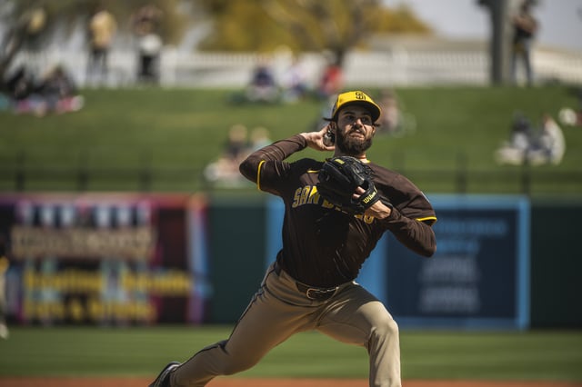 SURPRISE, ARIZONA - MARCH 6: Dylan Cease #84 of the San Diego Padres pitches during a spring training game against the Texas Rangers at Surprise Stadium on March 6, 2025 in Surprise, Arizona.