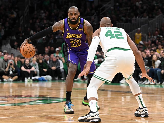 Mar 8, 2025; Boston, Massachusetts, USA; Los Angeles Lakers forward LeBron James (23) controls the ball against Boston Celtics center Al Horford (42) during the third quarter at the TD Garden. Brian Fluharty-Imagn Images/File Photo