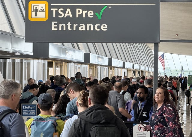 A crowd of travelers waits to check in at Dulles International Airport in Virginia on August 30, 2024, as Labor Day weekend approaches.