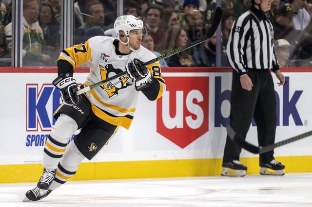 Mar 9, 2025; Saint Paul, Minnesota, USA;  Pittsburgh Penguins forward Sidney Crosby (87) heads up ice against the Minnesota Wild during the first period at Xcel Energy Center. Mandatory Credit: Nick Wosika-Imagn Images