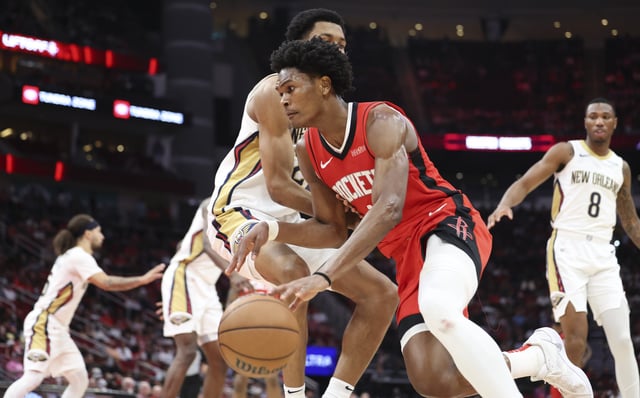 Mar 8, 2025; Houston, Texas, USA;  Houston Rockets forward Amen Thompson (1) dribbles the ball during the game against the New Orleans Pelicans at Toyota Center. Mandatory Credit: Troy Taormina-Imagn Images