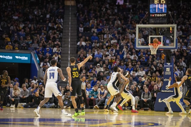 Warriors guard Stephen Curry hits a 3-pointer against the Orlando Magic on Feb. 3 at Chase Center. The growth of analytics played a role the skyrocketing volume of long-range shots.