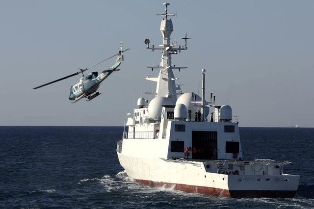 In this picture released by the official website of the Iranian Army on Wednesday, Jan 15, 2025, a helicopter flies over domestically-built signals intelligence Zagros ship that joined the navy fleet in the Gulf of Oman.