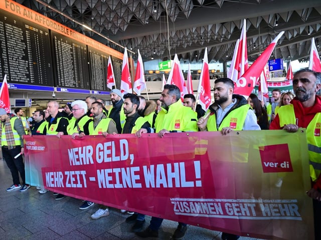 Workers on strike at Frankfurt Airport, where over 1,000 flights were canceled Monday.