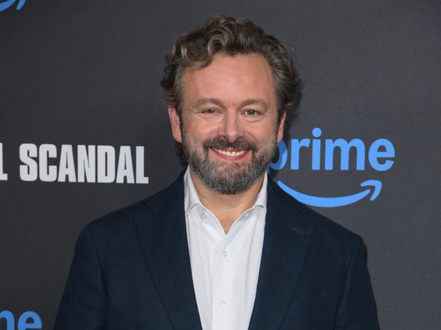 Michael Sheen used his own money to pay off £1 million in debt for his neighbors in his Welsh hometown.