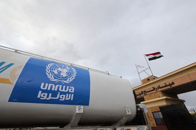 A truck, marked with United Nations Relief and Works Agency (UNRWA) logo, crosses into Egypt from Gaza, at the Rafah border crossing between Egypt and the Gaza Strip, during a temporary truce between Hamas and Israel, in Rafah, Egypt, November 27, 2023. REUTERS/Amr Abdallah Dalsh/File Photo