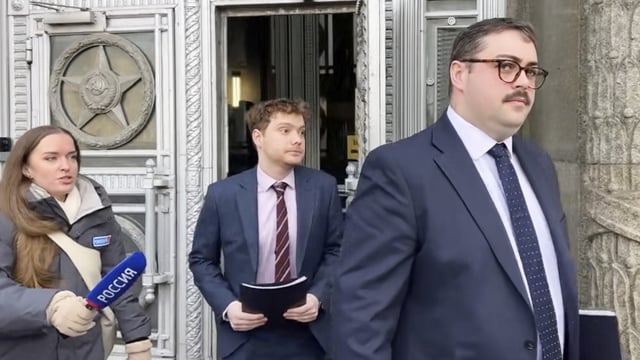 Representatives of the British embassy exit the main building of the Russian Foreign Ministry in Moscow, Russia, after a decision to revoke the accreditations of two British diplomats who had provided false personal information while seeking permission to enter Russia.