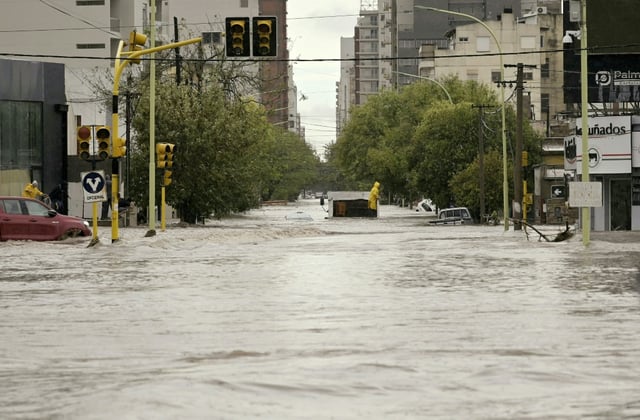 Torrential rains flooded homes and hospitals, destroyed roads and killed at least 16 people in the Argentine port city of Bahia Blanca