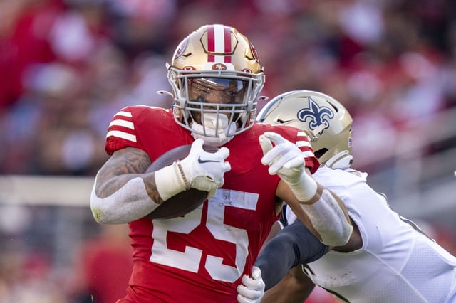 November 27, 2022; Santa Clara, California, USA; San Francisco 49ers running back Elijah Mitchell (25) runs against New Orleans Saints safety Marcus Maye (6) during the second quarter at Levi's Stadium. Mandatory Credit: Kyle Terada-USA TODAY Sports/File Photo