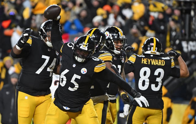 Jan 4, 2025; Pittsburgh, Pennsylvania, USA; Pittsburgh Steelers offensive tackle Dan Moore Jr. (65) celebrates after a touchdown by running back Najee Harris (22) against the Cincinnati Bengals during the second quarter at Acrisure Stadium. Mandatory Credit: Barry Reeger-Imagn Images/File Photo