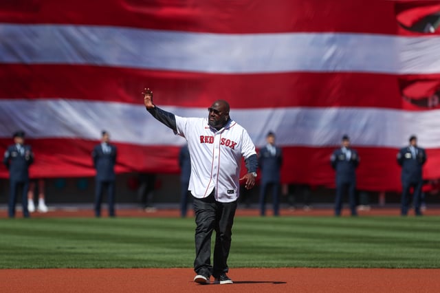 Apr 15, 2022; Boston, Massachusetts, USA; Former Boston Red Sox player Mo Vaughn (42) waves to the crowd at Fenway Park. Every player is wearing number 42 in honor of Jackie Robinson. Mandatory Credit: Paul Rutherford-USA TODAY Sports/File Photo