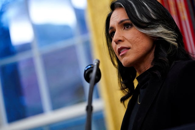 Tulsi Gabbard is sworn in as Director of National Intelligence at the White House in Washington, D.C., U.S., February 12, 2025. REUTERS/Nathan Howard/File Photo