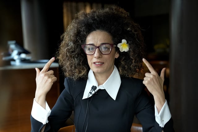 FILE - Masih Alinejad, 48, a prominent Iranian American human rights activist gives an interview Press in Berlin, Nov. 9, 2024. (AP Photo/Ebrahim Noroozi, File)