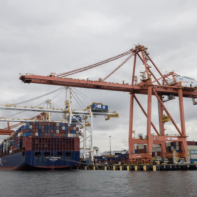 A ship is seen docked at Global Container Terminals Inc.'s Vanterm facility at the Port of Vancouver on Oct. 21, 2024.