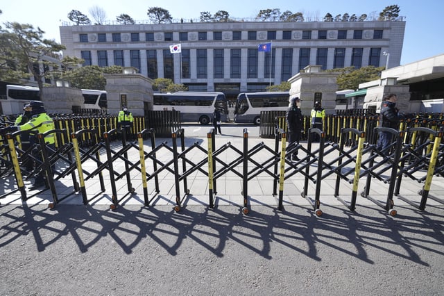 FILE - South Korean police officers stand guard in front of the Constitutional Court in Seoul, South Korea, on Feb. 18, 2025. (AP Photo/Lee Jin-man, File)