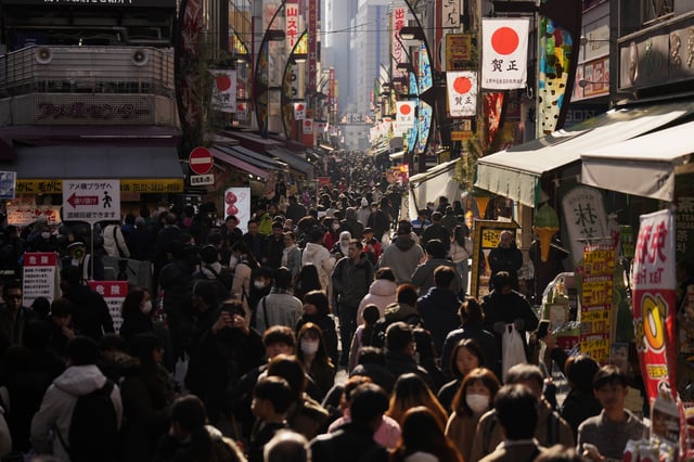 FILE - People crowd the famed "Ameyoko" shopping street on New Year's Eve in Tokyo, Tuesday, Dec. 31, 2024. (AP Photo/Hiro Komae, File)