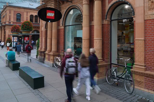 People pass a Lego store in Copenhagen, Denmark August 29, 2023. REUTERS/Tom Little/File Photo