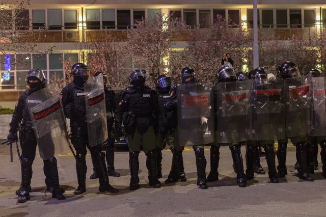 CORRECTS DATE TO MONDAY - Serbian law enforcement stand as hundreds of students block the public broadcaster RTS building in central Belgrade, Serbia, Monday, March 10, 2025. (AP Photo/Marko Drobnjakovic)