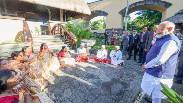 Prime Minister Narendra Modi receives a warm welcome from the members of the Indian diaspora as he arrives at a hotel, in Port Louis on Tuesday.