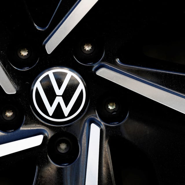 A logo of Volkswagen is seen inside a car dealer in Nijmegen, Netherlands February 26, 2025. REUTERS/Piroschka van de Wouw