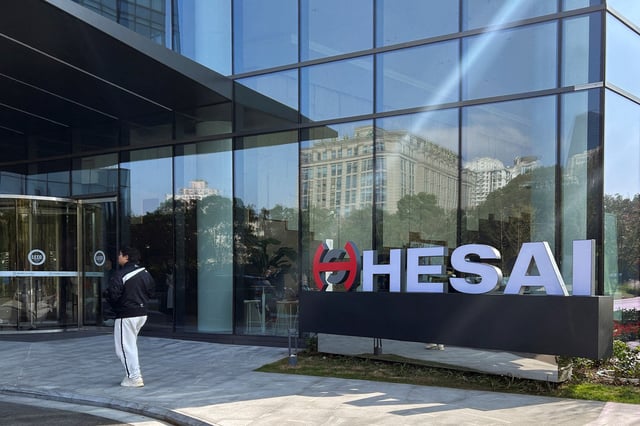 A person walks outside the headquarters of lidar sensor maker Hesai Group in Shanghai, China November 26, 2024. REUTERS/Zoey Zhang/File Photo