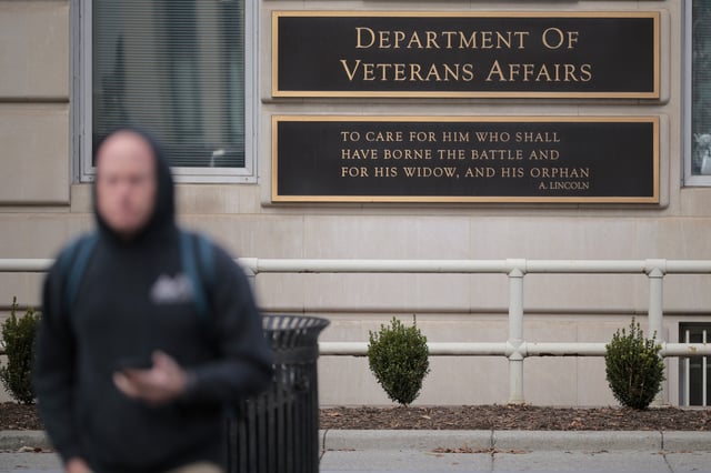 A person walks past the Department of Veterans Affairs headquarters a block from the White House on March 06, 2025, in Washington, DC.