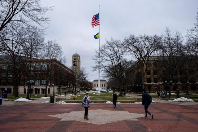 FILE — Students walk through The Diag at the University of Michigan in Ann Arbor, Mich., Feb. 2, 2024. Instead of speaking out on the hot-button debates of the day, more schools are making it a policy to stay silent as political pressure mounts against higher education. (Nic Antaya/The New York Times)