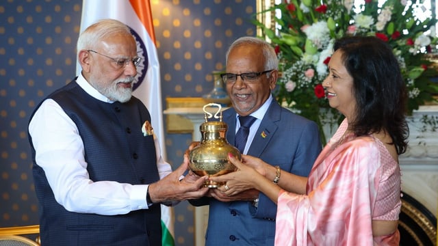 PM Narendra Modi gifts Gangajal water from Maha Kumbh in a brass and copper pot to Mauritius President Dharam Gokhool.