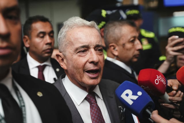 Former Colombian President Alvaro Uribe speaks to the press after attending his first criminal trial hearing, pleading not guilty to procedural fraud and witness bribery charges, in Bogota, Colombia February 10, 2025. REUTERS/Nathalia Angarita