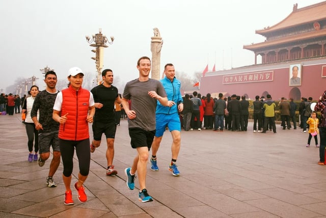 Facebook co-founder Mark Zuckerberg and five others jog through Tiananmen Square in Beijing in March 2016.