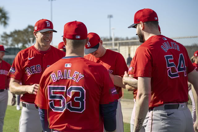 Nick Pivetta #37 and Lucas Giolito #54 of the Boston Red Sox talk with pitching coach Andrew Bailey during a spring training team workout on February 14, 2024 at jetBlue Park at Fenway South in Fort Myers, Florida.