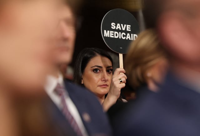 Representative Sara Jacobs (D-Calif.) holds a &#34;SAVE MEDICAID&#34; protest sign as President Donald Trump addresses a joint session of Congress at the U.S. Capitol in Washington, D.C., on March 4, 2025.