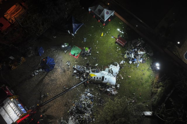 FILE - The debris of an airplane that crashed the previous day lays in Vinhedo, Sao Paulo state, Brazil, early Aug. 10, 2024. (AP Photo/Andre Penner)