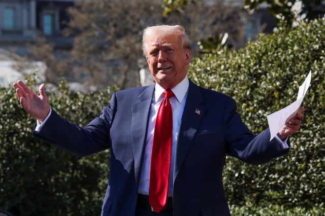U.S. President Donald Trump talks to the media, next to Tesla CEO Elon Musk (not pictured), at the White House in Washington, D.C., U.S., March 11, 2025. REUTERS/Kevin Lamarque