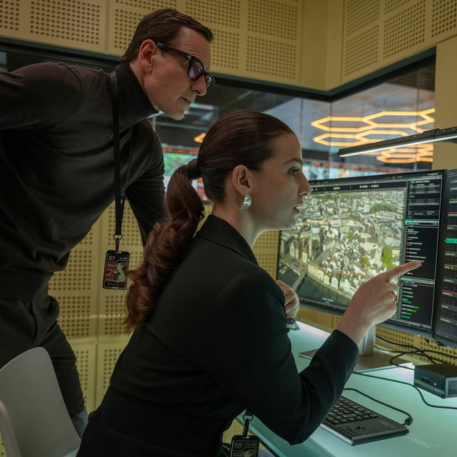This image released by Focus Features shows Michael Fassbender, left, and Marisa Abela in a scene from "Black Bag." (Claudette Barius/Focus Features via AP)